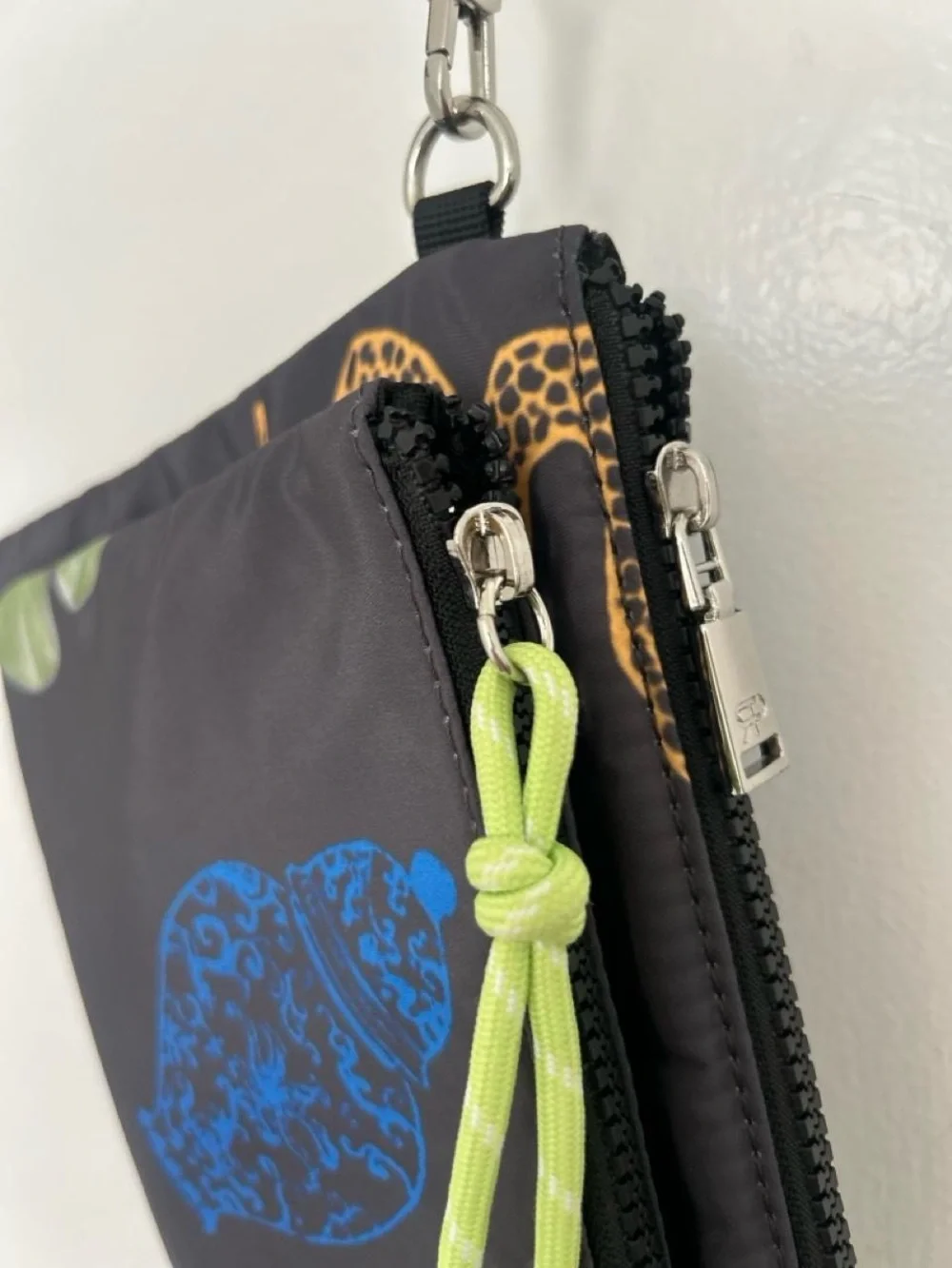 Printed Black Nylon Wristlet Pouch with Lime Accent from Parfois